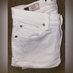 Gap white mid rise skinny jeans.